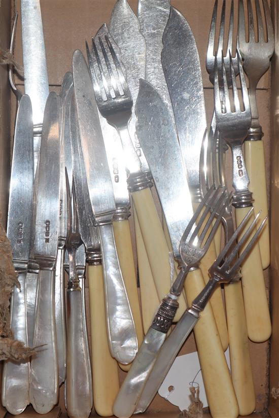 Two incomplete sets of silver fish eaters and dessert eaters, one with ivory handles, the other with mother of pearl.